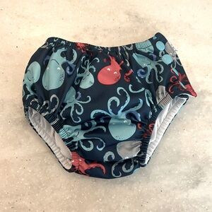Baby swim diaper. Size 12 months with side snaps.